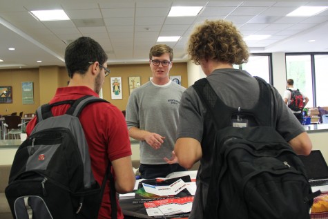 Matt Carl '17 talks with a group of first-years about a program in Germany at the Study Abroad Fair in Leyburn.