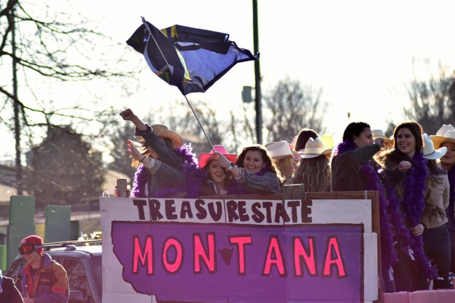 Montana+delegates+wave+flags+atop+their+float.+Photo+by+Lilah+Kimble%2C+23.