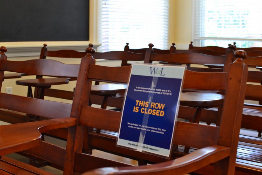 Signs block off chairs in the classrooms of Chavis Hall to facilitate social distancing.