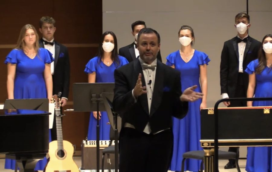 Dr. Shane Lynch addresses the audience at the choral performance from University Singers, Glee Club and Cantatrici on Oct. 1. Screenshot from livestream provided by Catherine McKean, ’24.