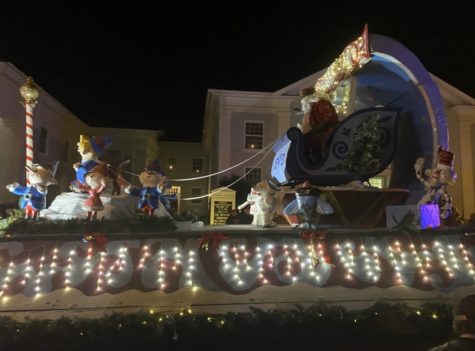 A float with Santa and Mrs. Claus proceeded down Main Street as part of Lexington’s Christmas parade. The annual event was downsized last year due to COVID-19. Photo by Shauna Muckle, ’24.