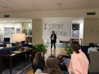 SPEAK members read stories submitted by student survivors. Photo by Anneliese Schneider, ’23