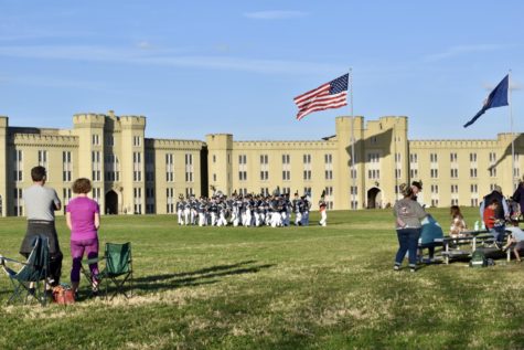 Cadets march outside in front of onlookers on VMI’s campus. This year’s incoming class is composed of 375 cadets, a steep drop from the typical class size of roughly 500.