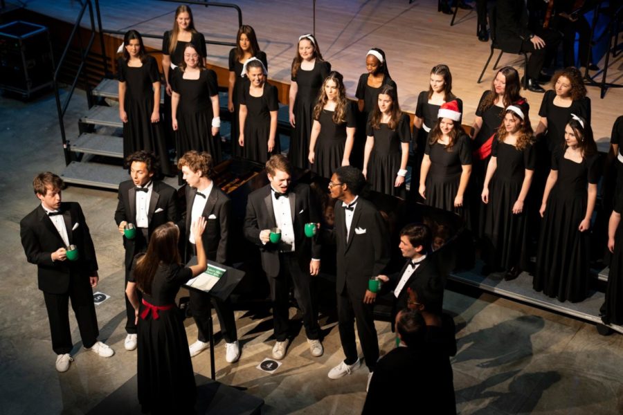 Kristina Ayers, ‘25, conducts the Glee Club. Photo courtesy of the Washington and Lee Facebook 