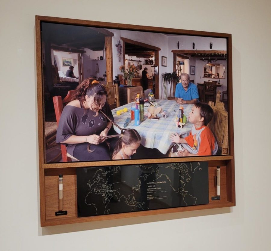 An art piece shows a family gathered around a kitchen table.