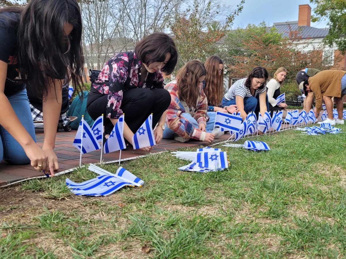 Students line Stemmons Plaza with flags representing lives lost in Israel on Wednesday.