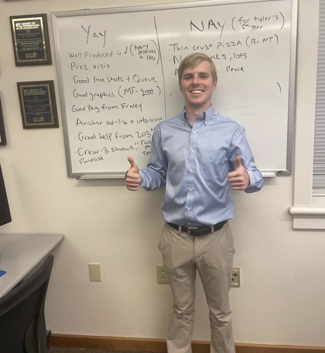 Lead producer Jack Hunter, 24, beams in front of a white board during the Rockbridge Reports Election Night coverage. (Courtesy of Rockbridge Report Instagram)
