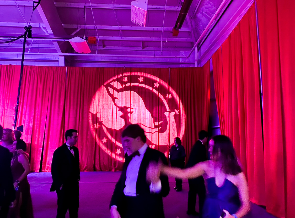 The Republican Party logo is projected on the wall as students dance nearby. The Presidential Gala happens only once in every four years. Photo by Shauna Muckle, ’24