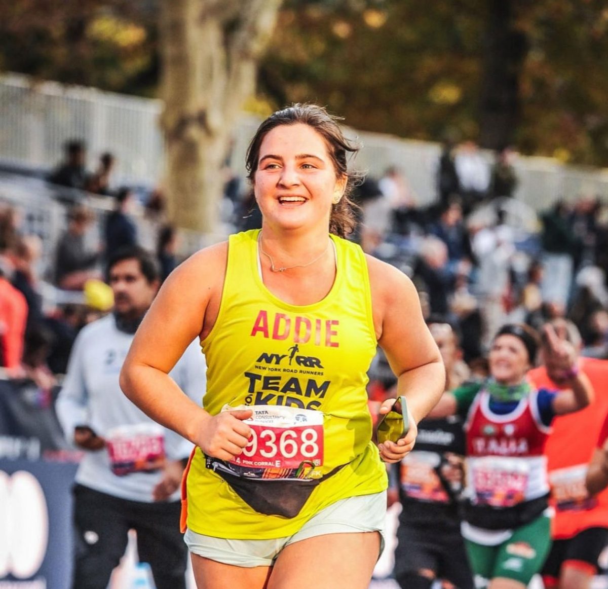Addie-Grace+Cook%2C+%E2%80%9826%2C+runs+with+a+smile+through+the+boroughs+of+New+York+City+in+early+November%2C+completing+a+marathon.+Photo+courtesy+of+Cook