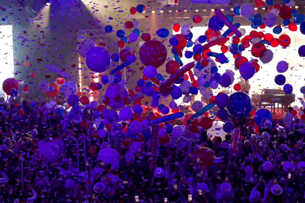 Balloons shower the convention hall after Billy Ray Cyrus performs with Firerose.