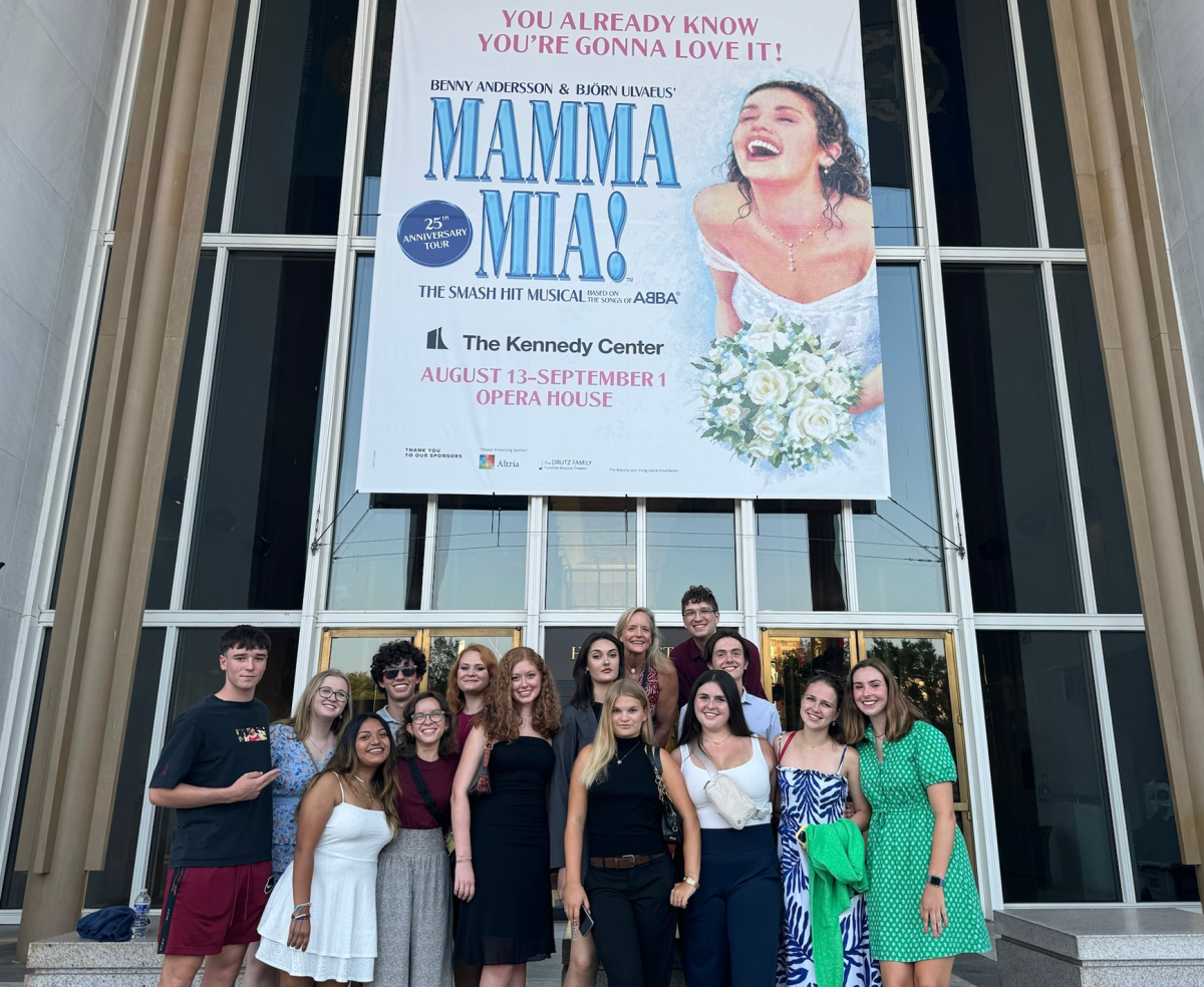 Students from the Home is Where the Art is leading edge trip pose in front of The Kennedy Center in Washington, D.C. after watching a performance of "Mamma Mia."