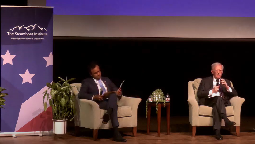 Vivek Ramaswamy, left, and John Bolton, right, debate foreign policy at Virginia Military Institute. 