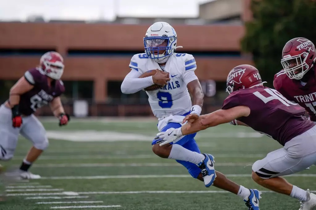 Ty Collins, ‘27, carries the ball during the Trinity game.