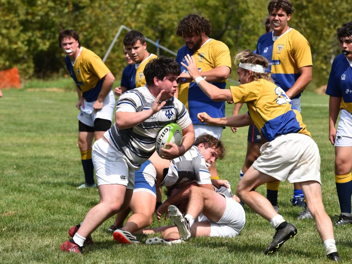 Screaming Minks player Andrew Lavayen, ‘27, carries the ball in the team’s first matchup of the year versus Emory and Henry University. 