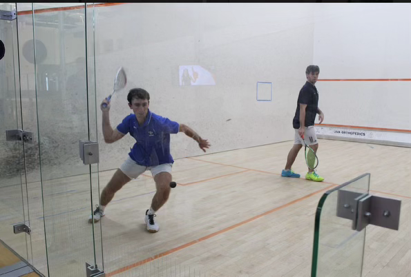 John Williams, ’25, plays in a squash tournament on W&L’s campus.