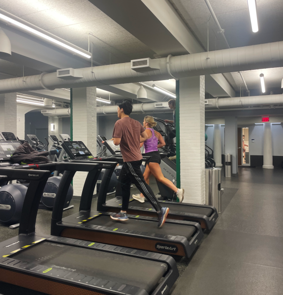 Students running on treadmills in the fitness center at the Duchossois Athletic and Recreation Center. 