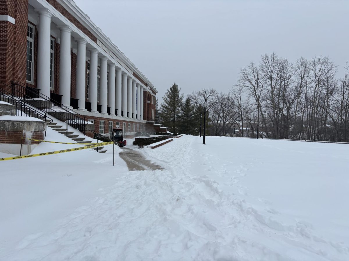 A snowplow clears the way to the Richard L. Duchossois Athletic and Recreation Center. Coming to campus during snowstorms is part of the job description for essential employees. 
