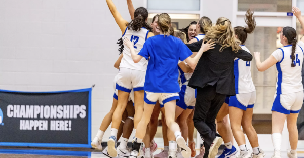 The Washington and Lee women’s basketball team celebrates their 61-55 victory over Christopher Newport University in the second round of the NCAA Tournament on March 7.